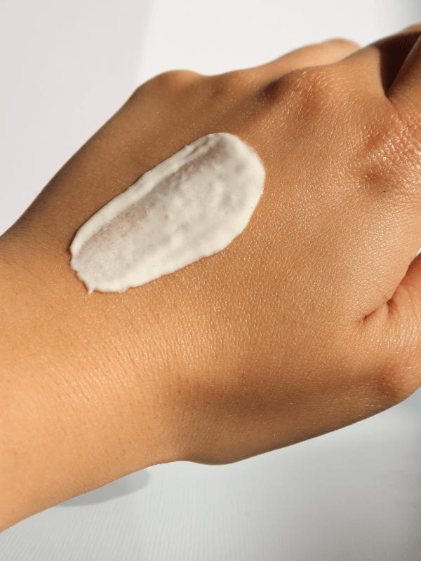 Eclat Soin Silk Skin Hand Cream applied to a hand showing its smooth texture and moisturizing properties